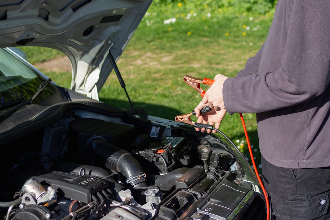 Man charging a car battery