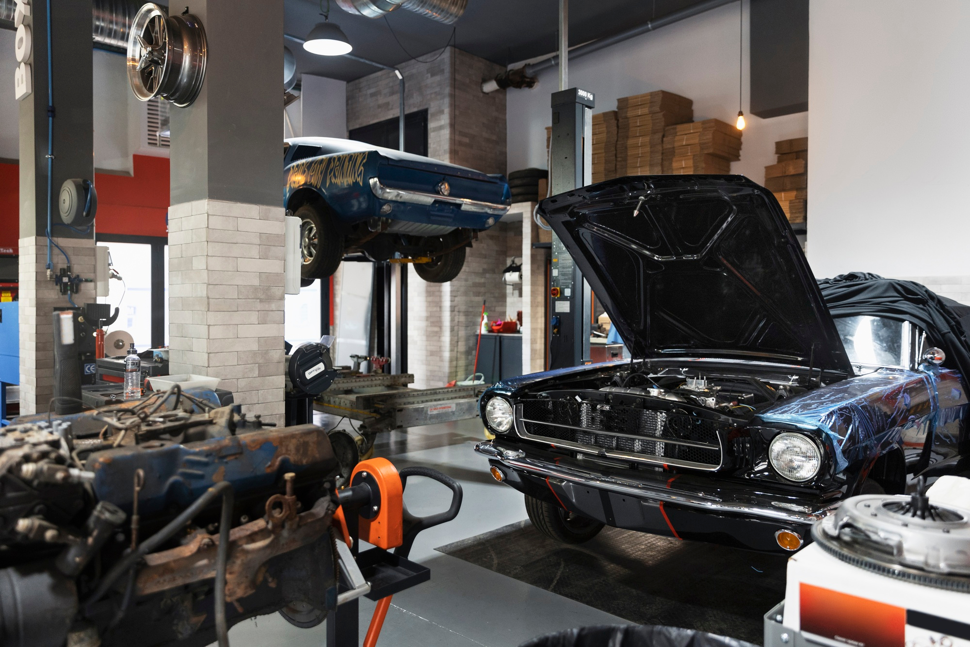 Vehicles undergoing maintenance at a repair shop