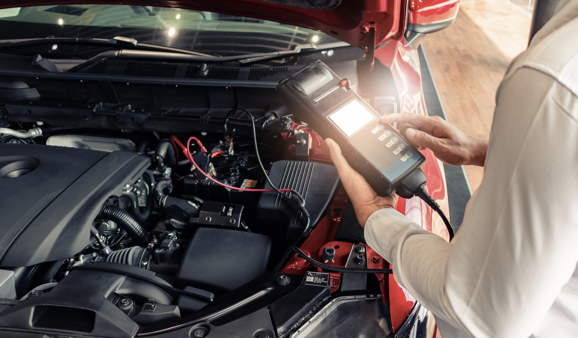 Mechanic conducting engine diagnostics