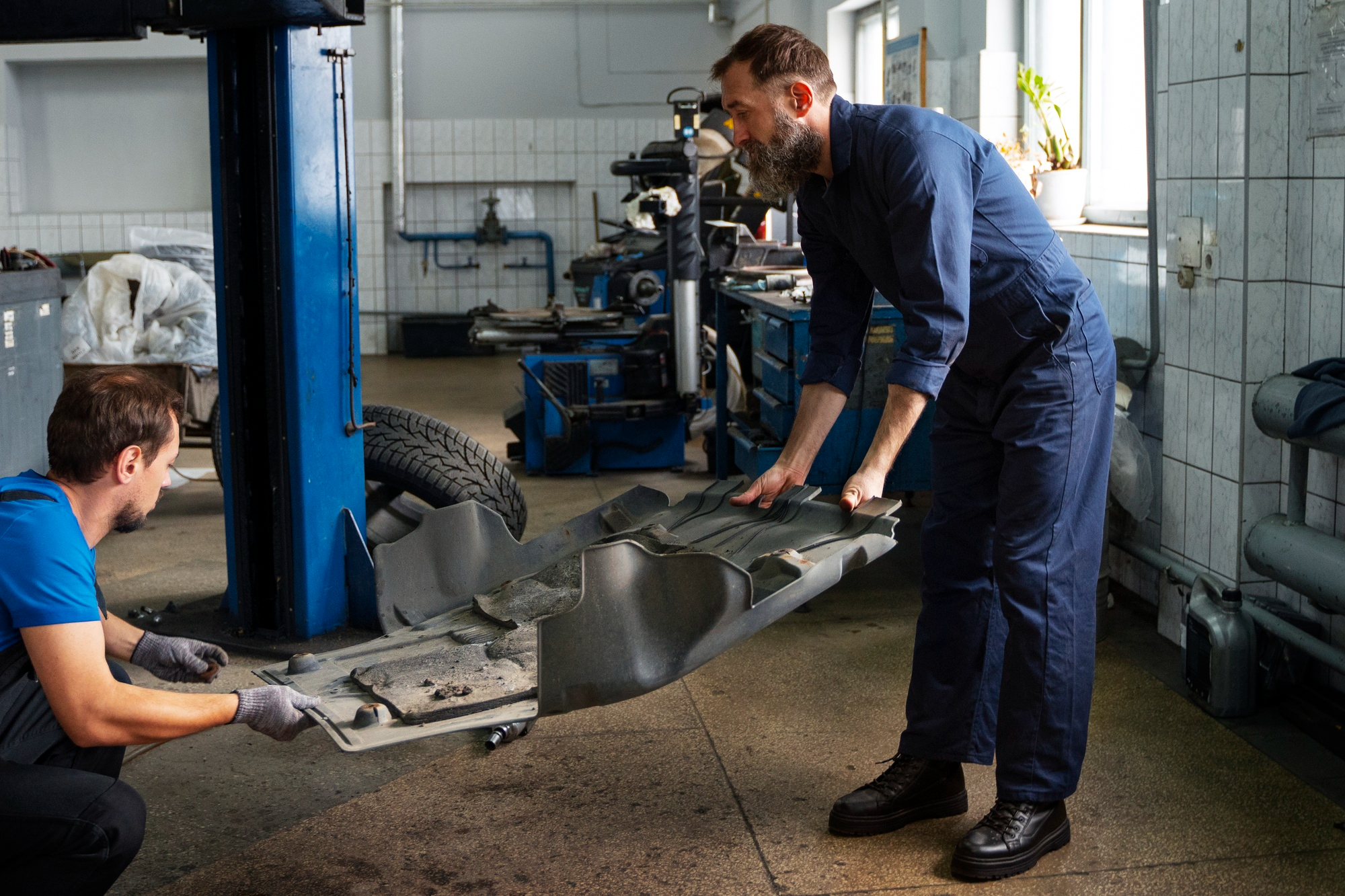 Mechanics working on vehicle maintenance