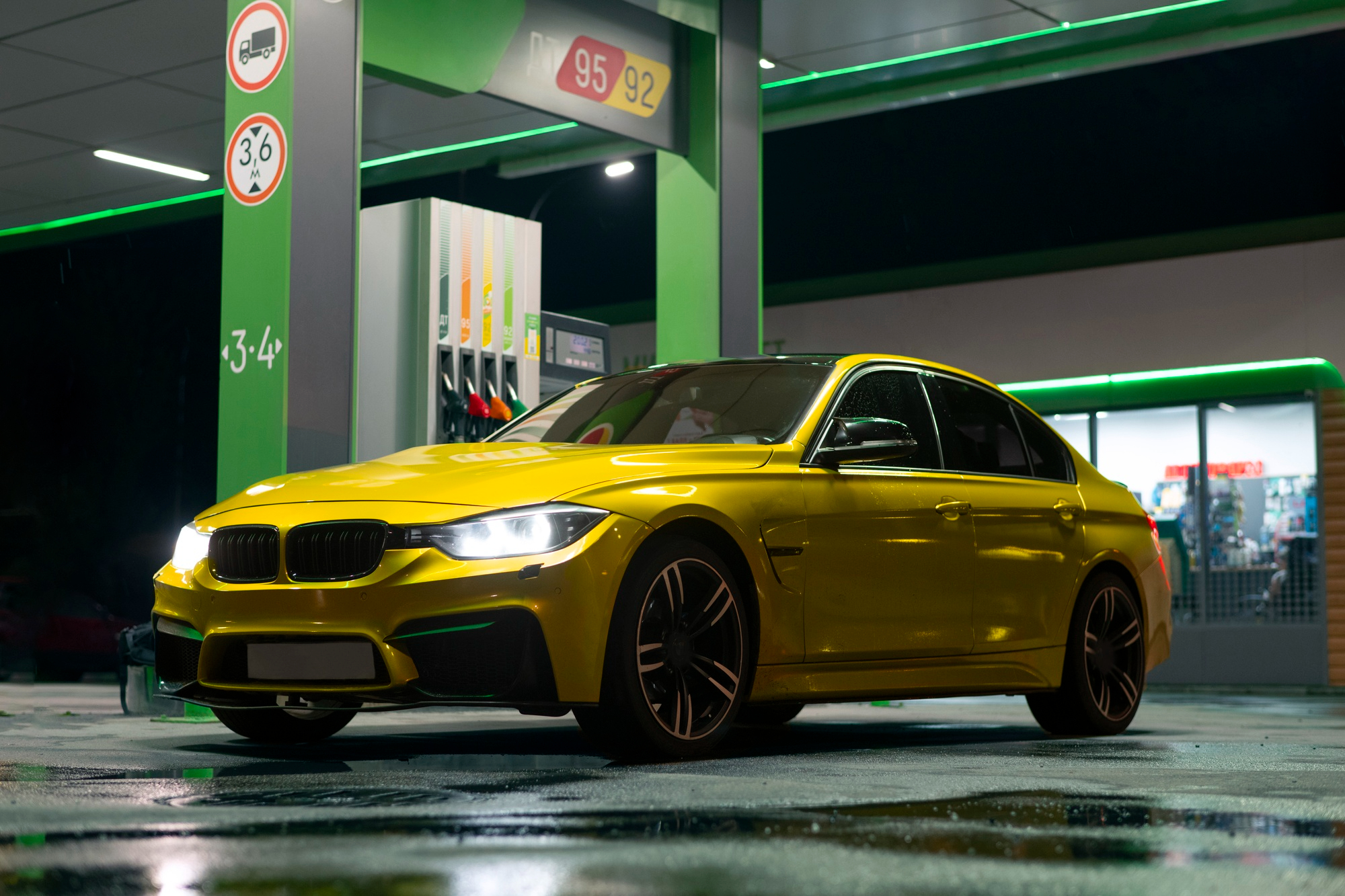 BMW parked at a gas station