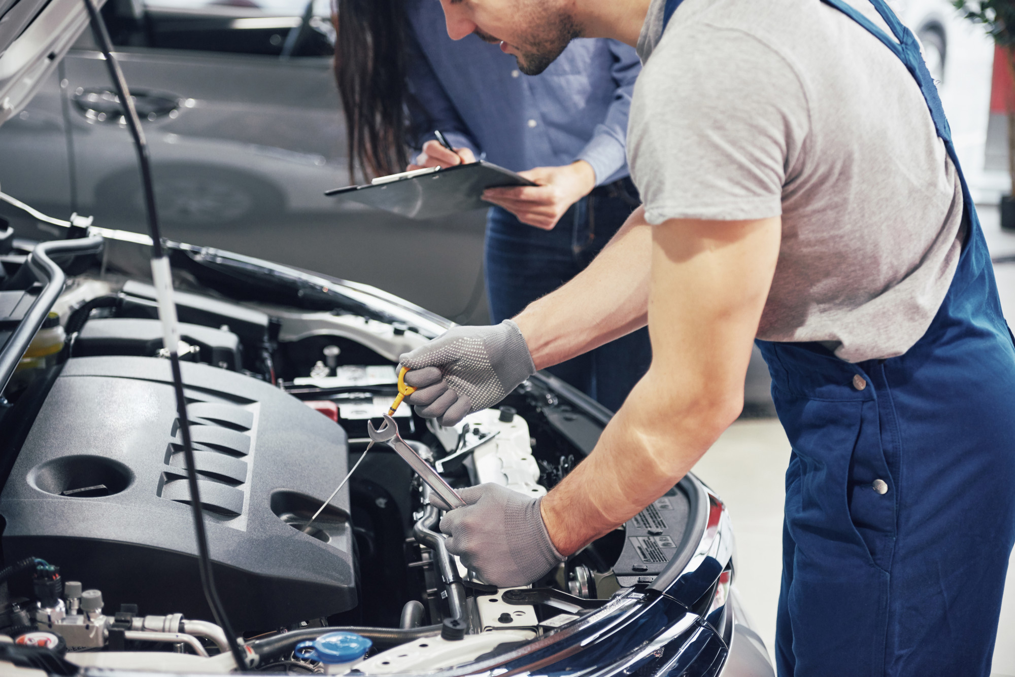 Mechanic inspecting potential engine faults 